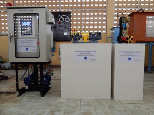 From the left, the donated water supply unit, a cut model of the land pump, and a cut model of the submersible pump